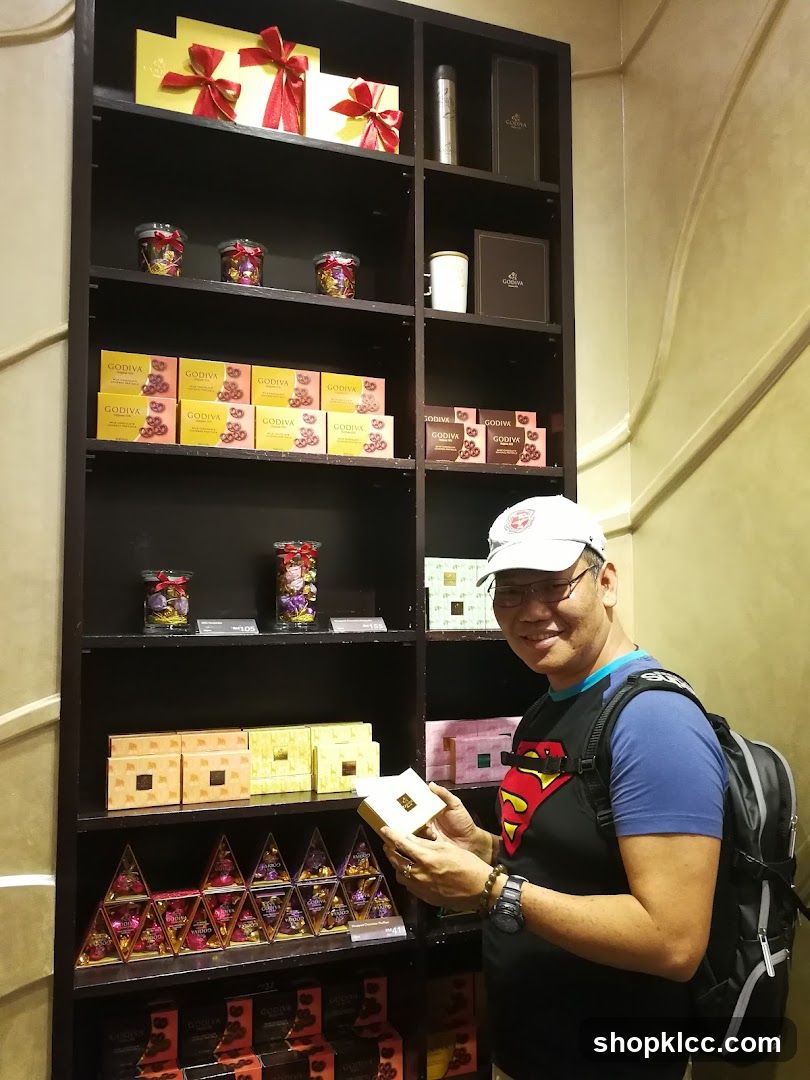 Man holding a Godiva chocolate box