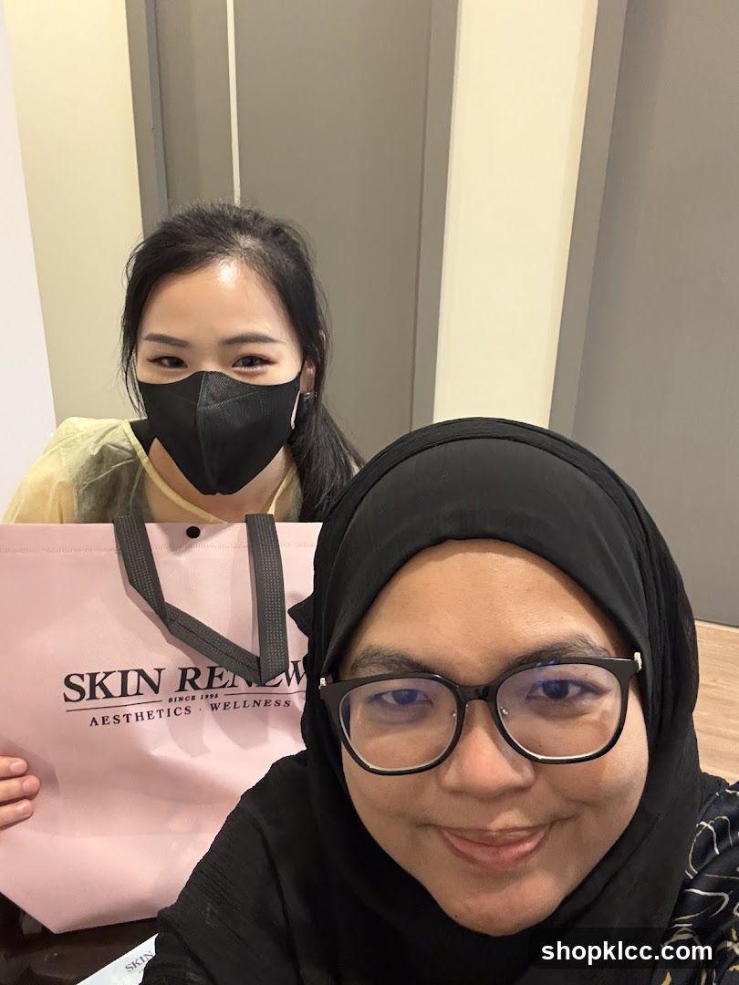 Two Women with a Branded Bag