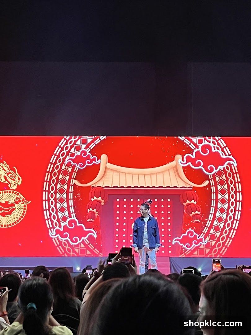 Man on Stage with Chinese New Year Themed Backdrop