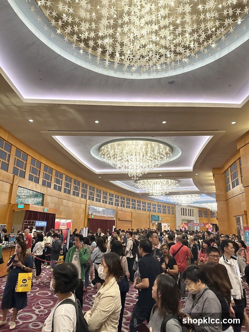 Crowded Convention Hall with Ornate Chandeliers