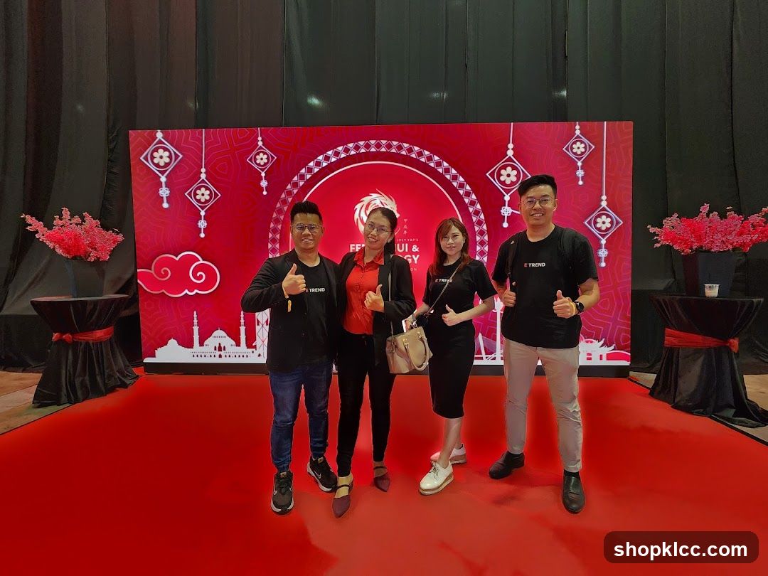 Group posing in front of a festive backdrop