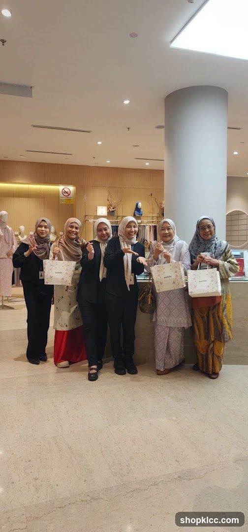 Women Posing with Shopping Bags