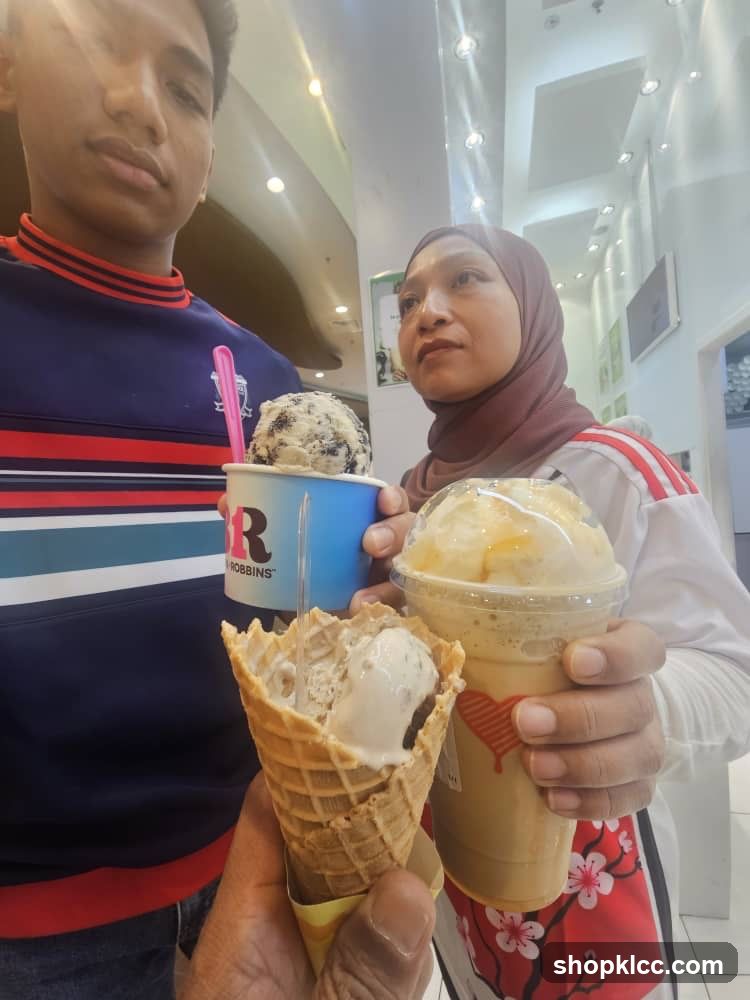 People holding ice cream and a drink