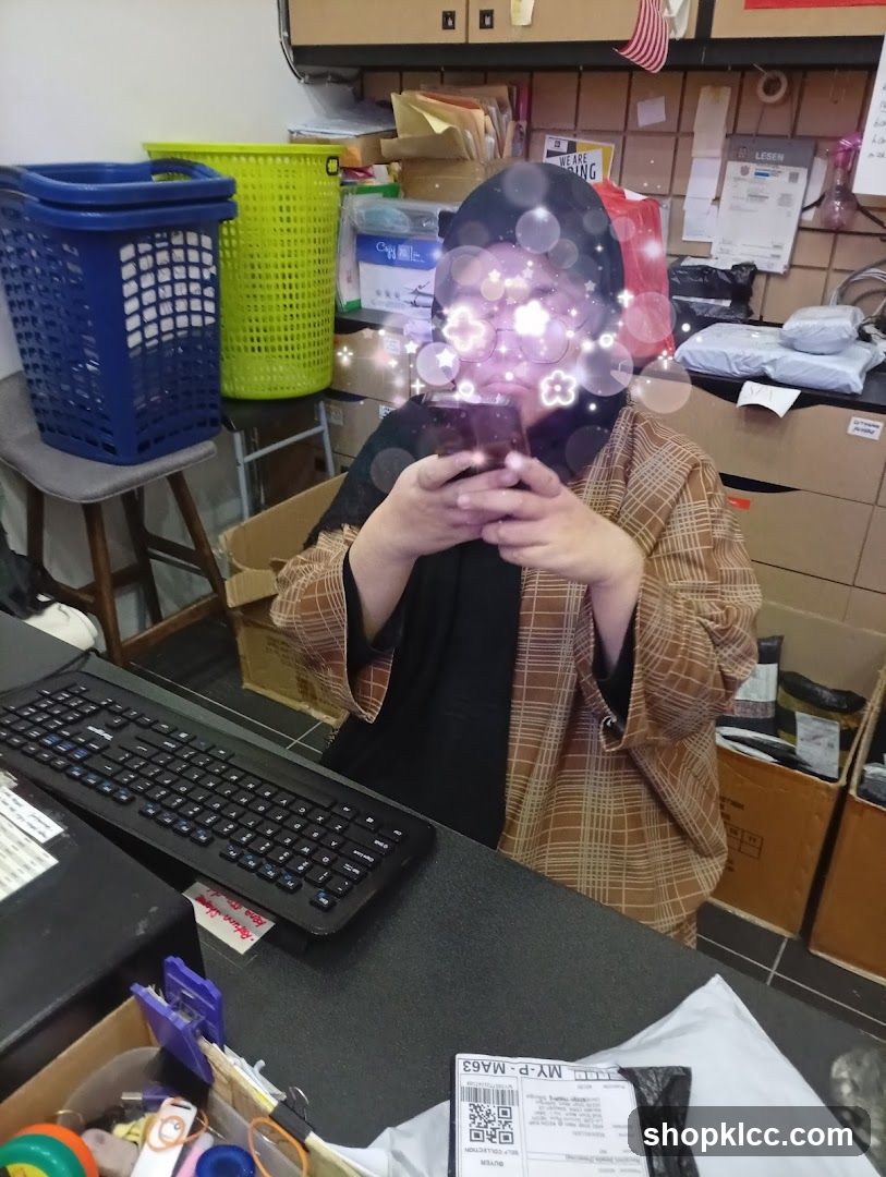 Person using a smartphone at a desk