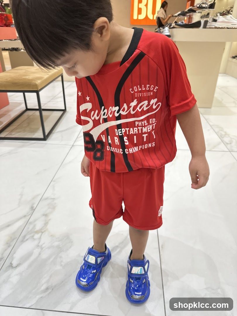 Boy in Red Athletic Outfit and Blue Car Shoes