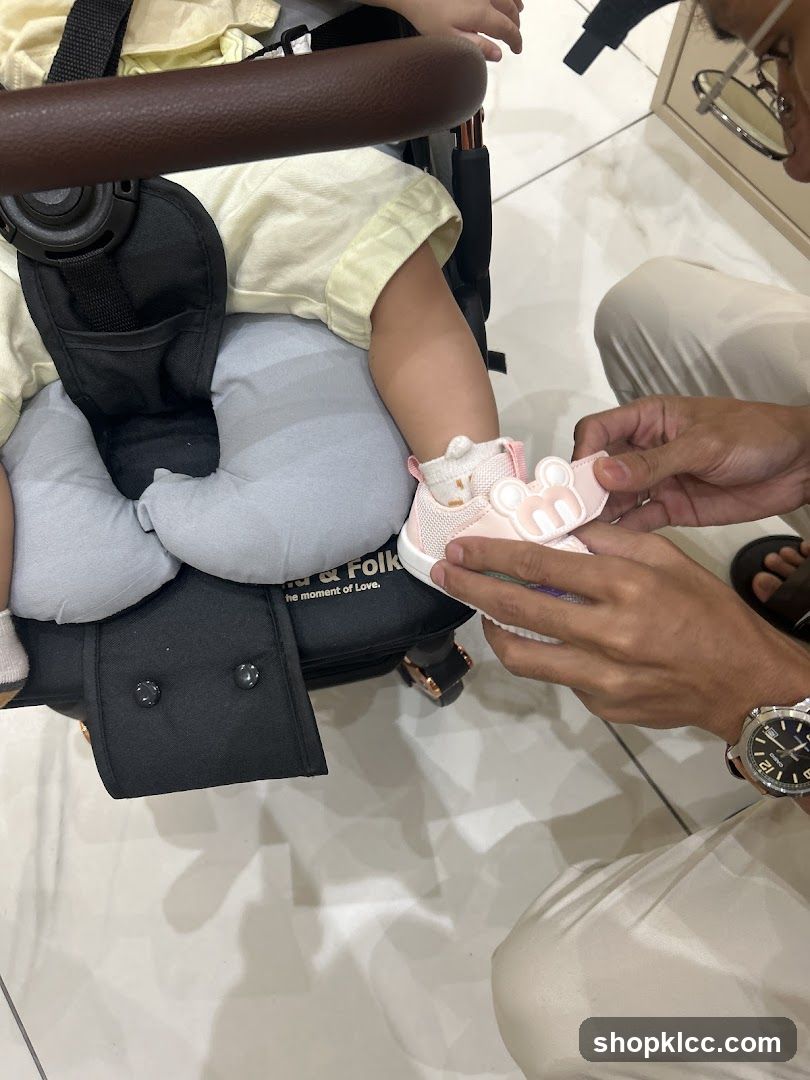 Putting on a baby shoe