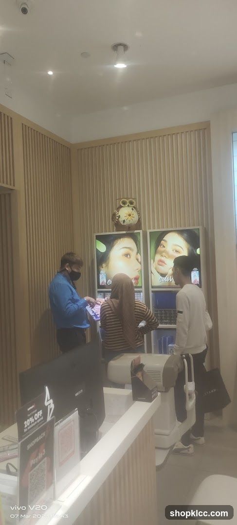 Cosmetics display with customers