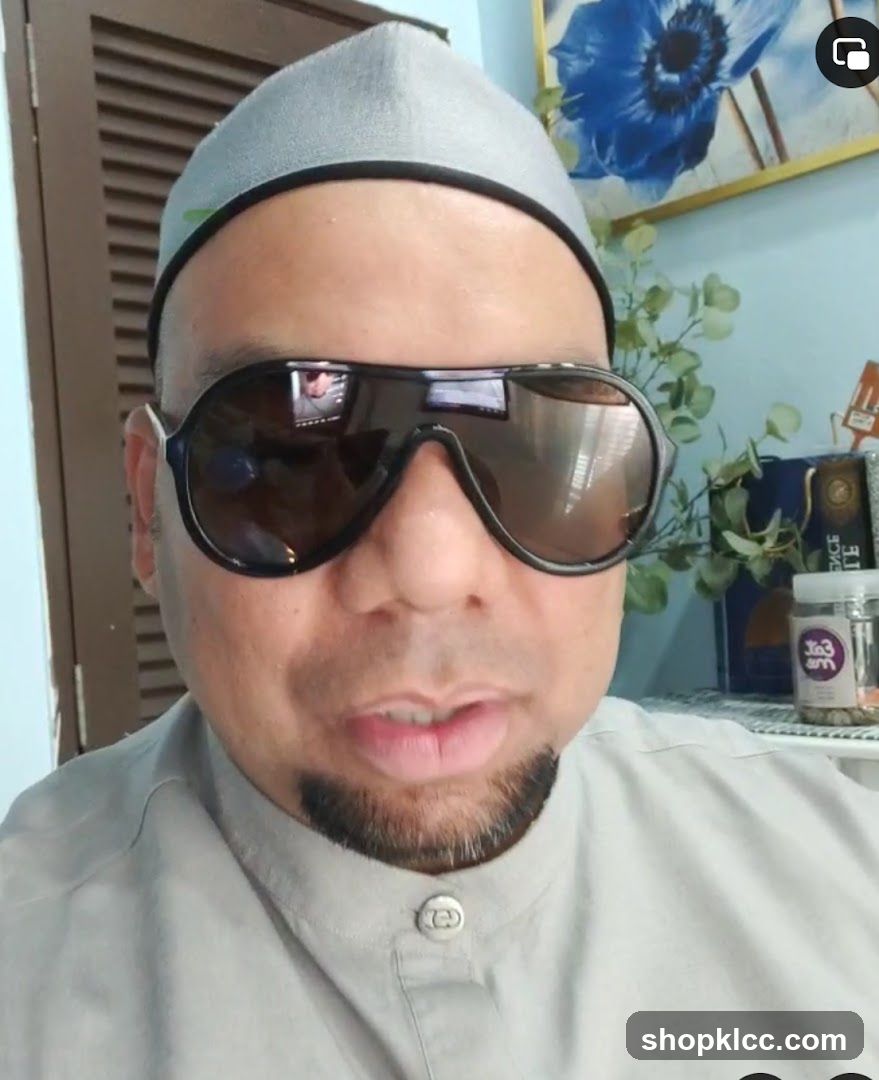 Man wearing sunglasses and a cap