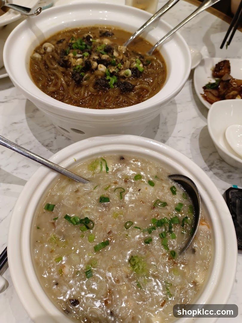 Two bowls of soup with noodles and toppings