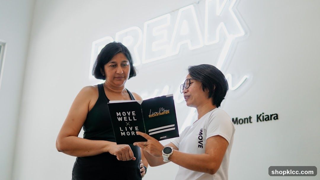 Two women discussing a booklet