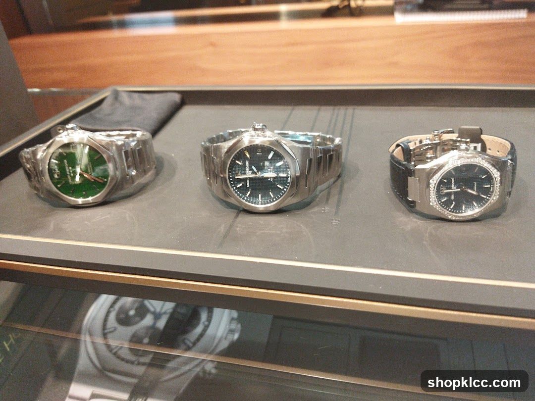 Three luxury watches on display