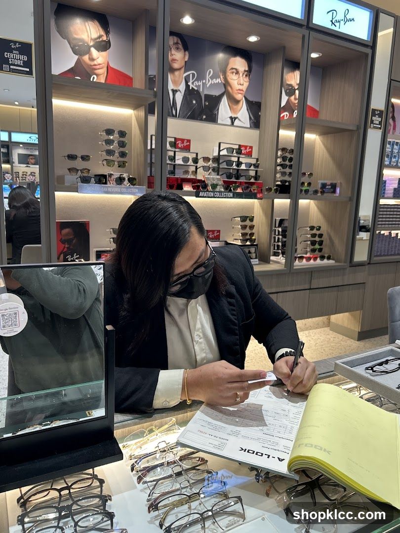 Optician assisting customer