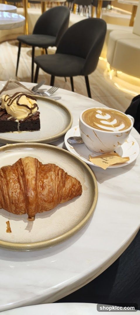 Cafe Table with Pastries and Coffee
