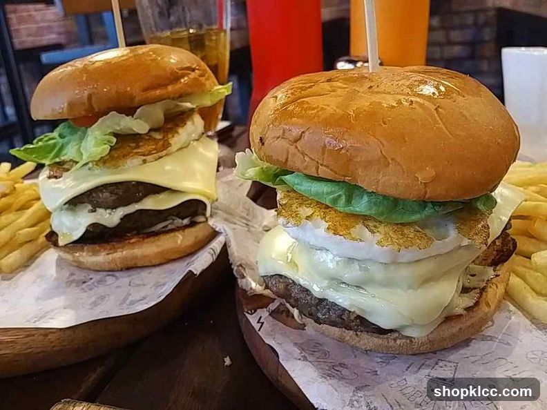 Two gourmet burgers with fries