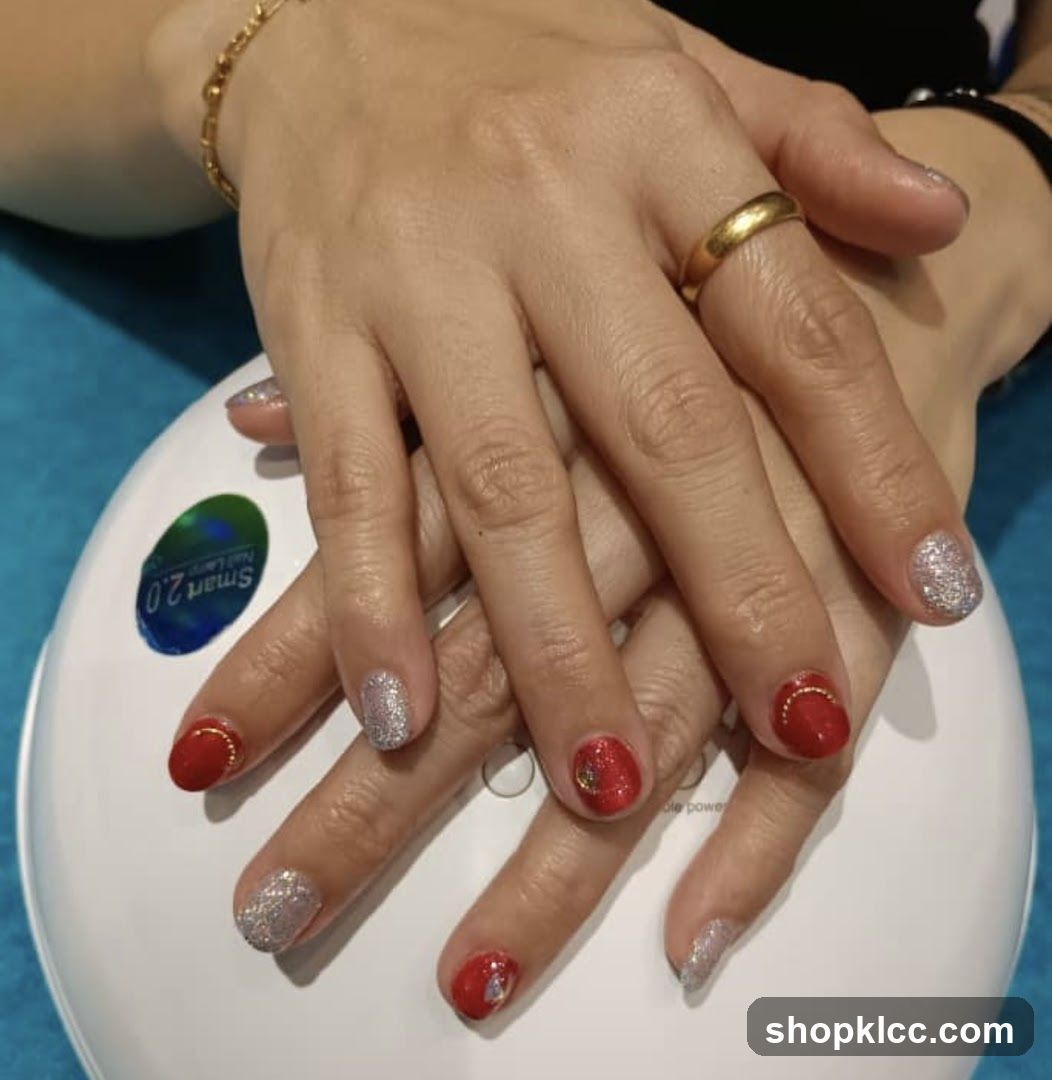 Manicured Hands with Red and Silver Glitter Polish