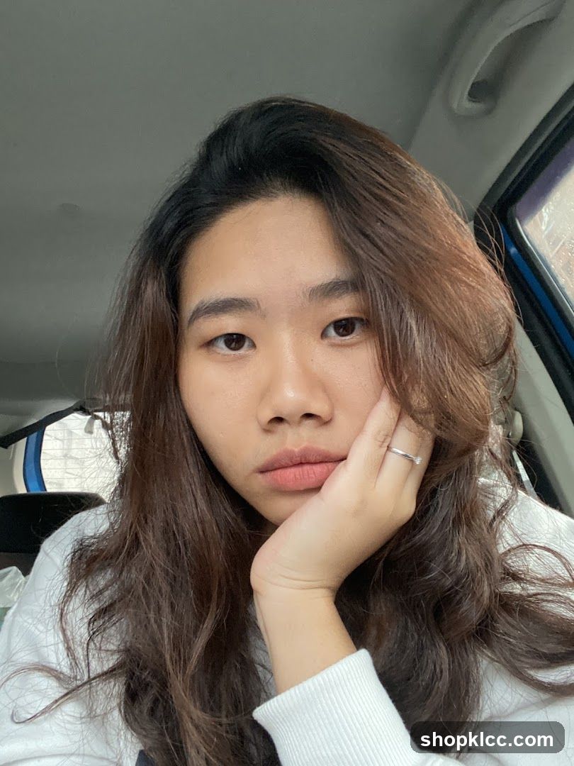 Woman resting her chin on her hand