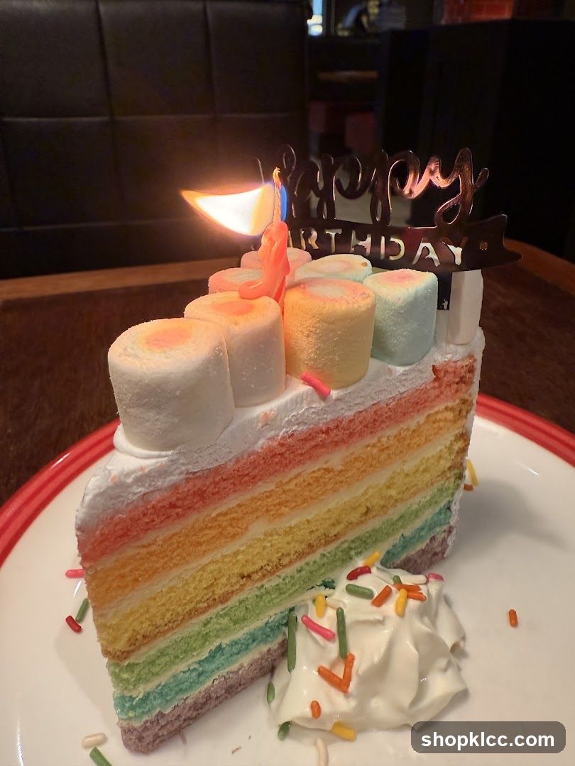 Rainbow Layer Cake Slice