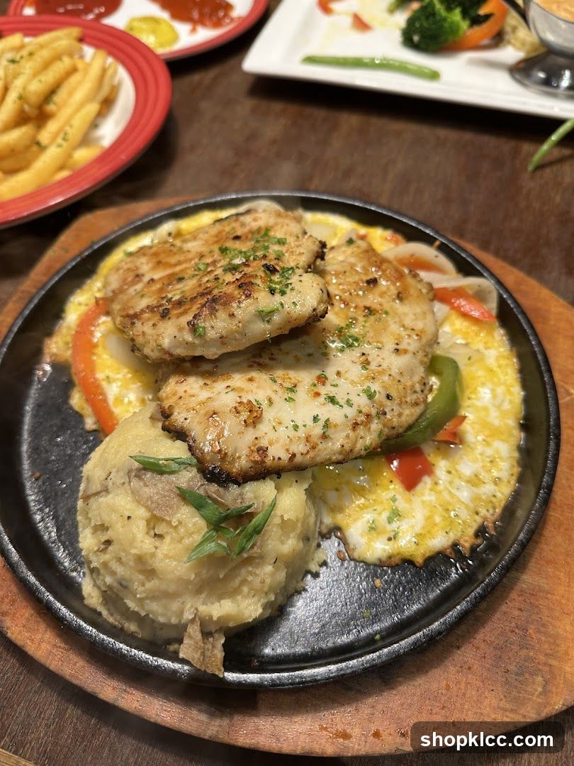 Sizzling Chicken Steak with Mashed Potatoes and Fries