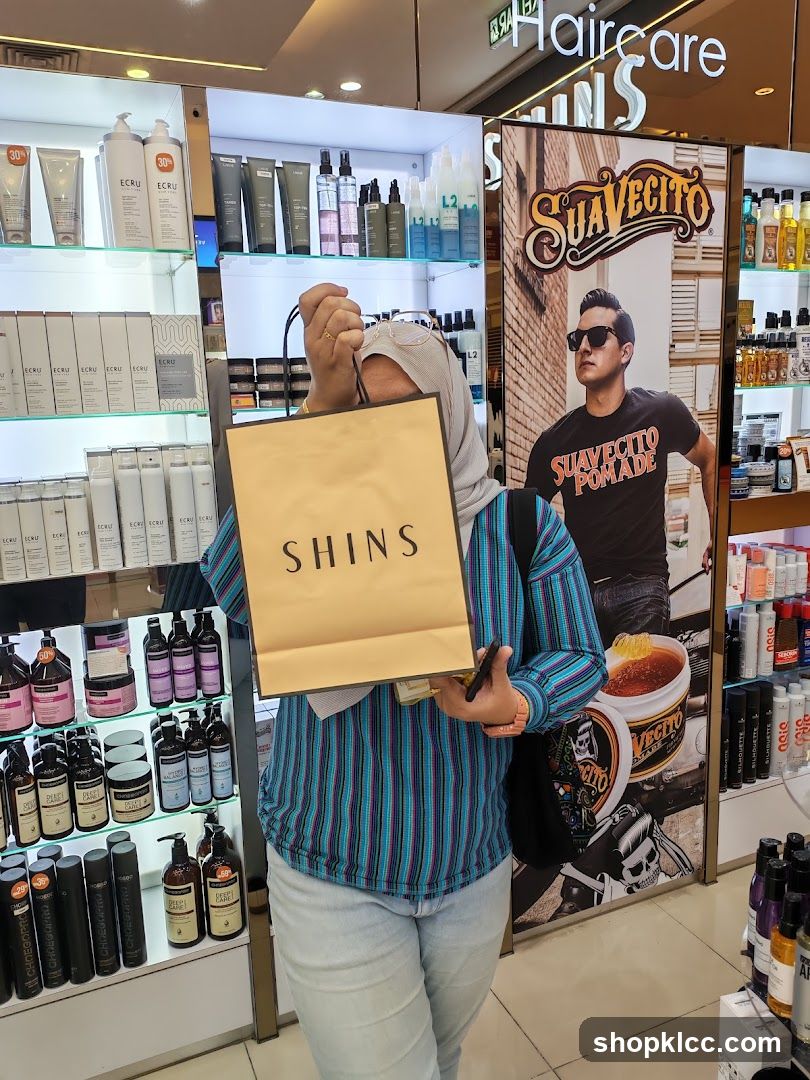 Person holding a shopping bag in a store