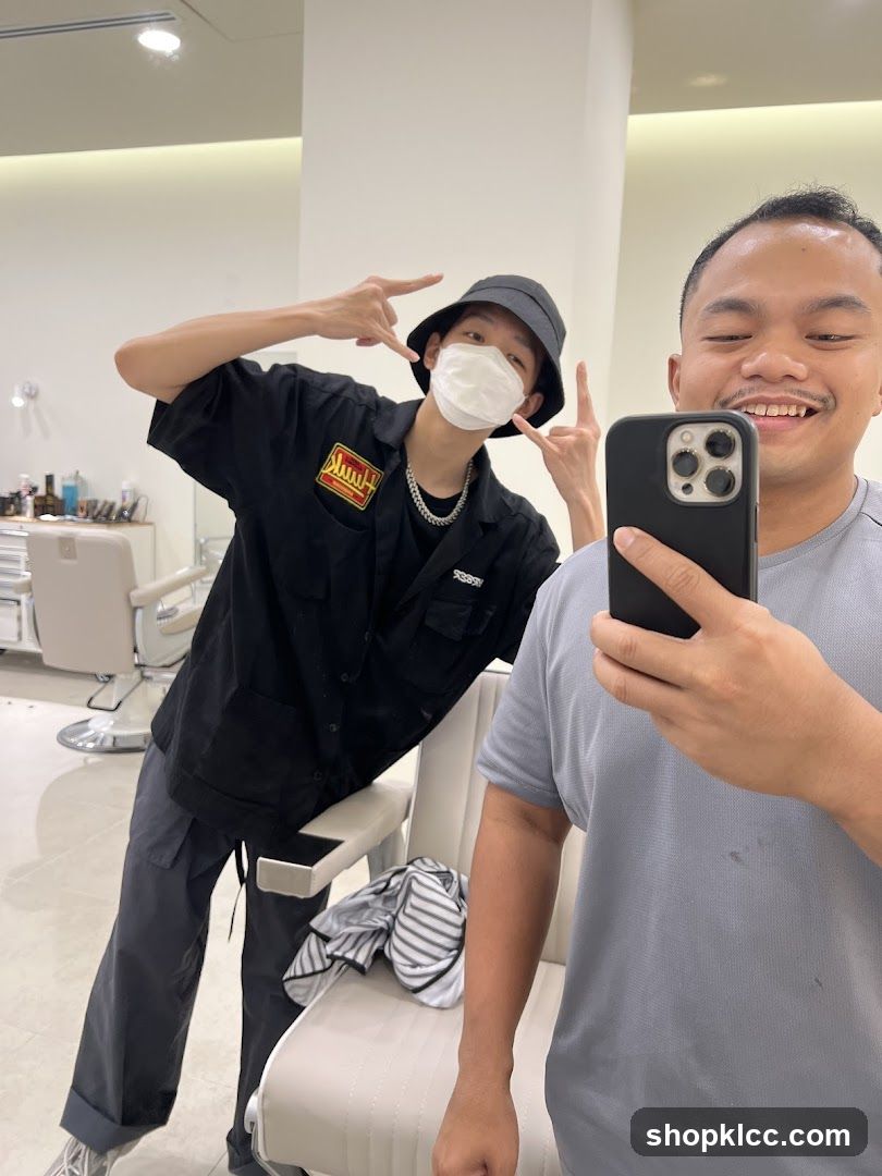 Two men taking a selfie in a salon