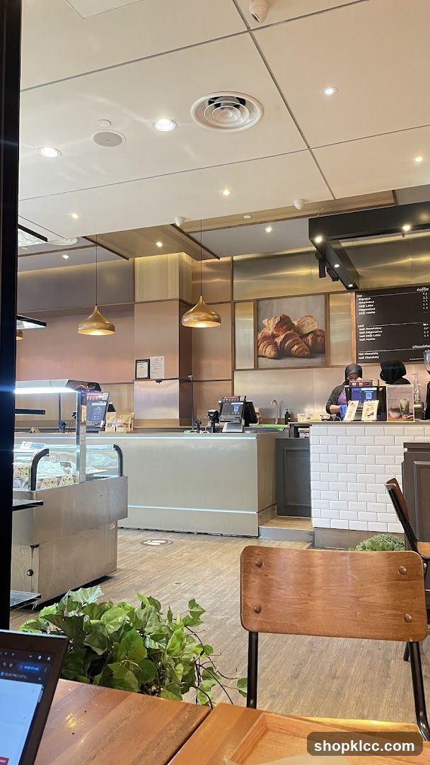 Cafe Interior with Croissant Art