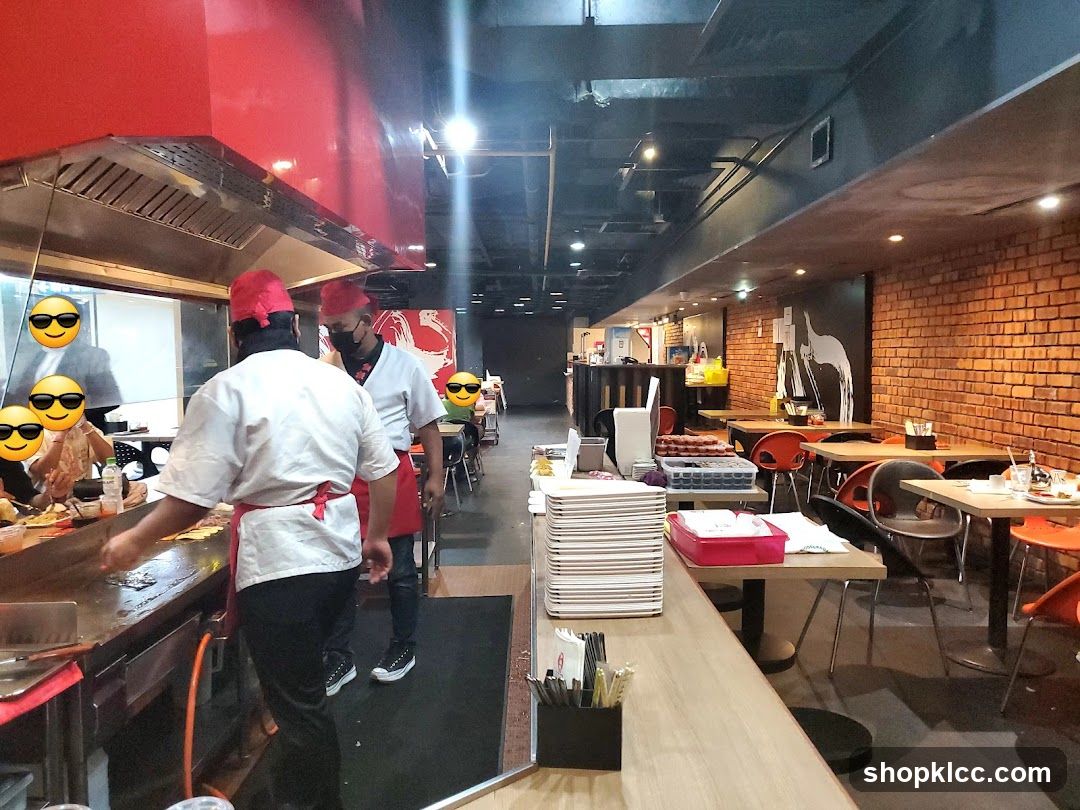 Restaurant Interior with Chefs and Dining Area