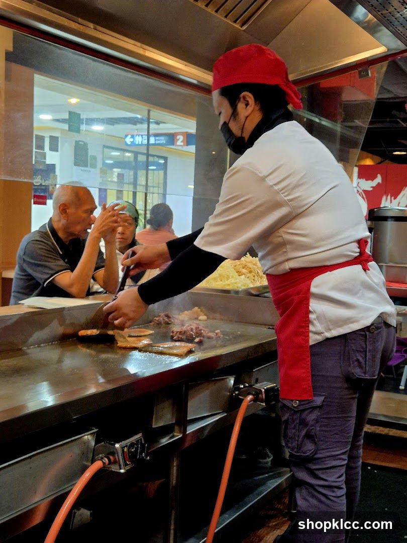 Chef cooking on a griddle