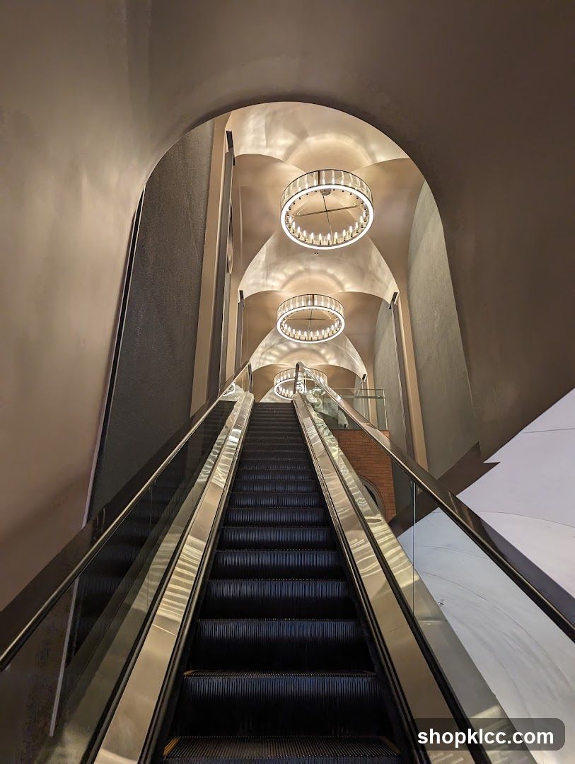 Elevated Interior Staircase with Chandeliers