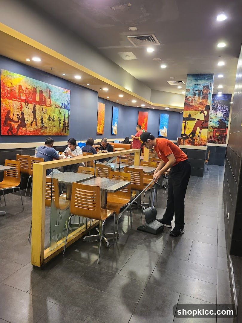 Restaurant Interior with Staff Cleaning