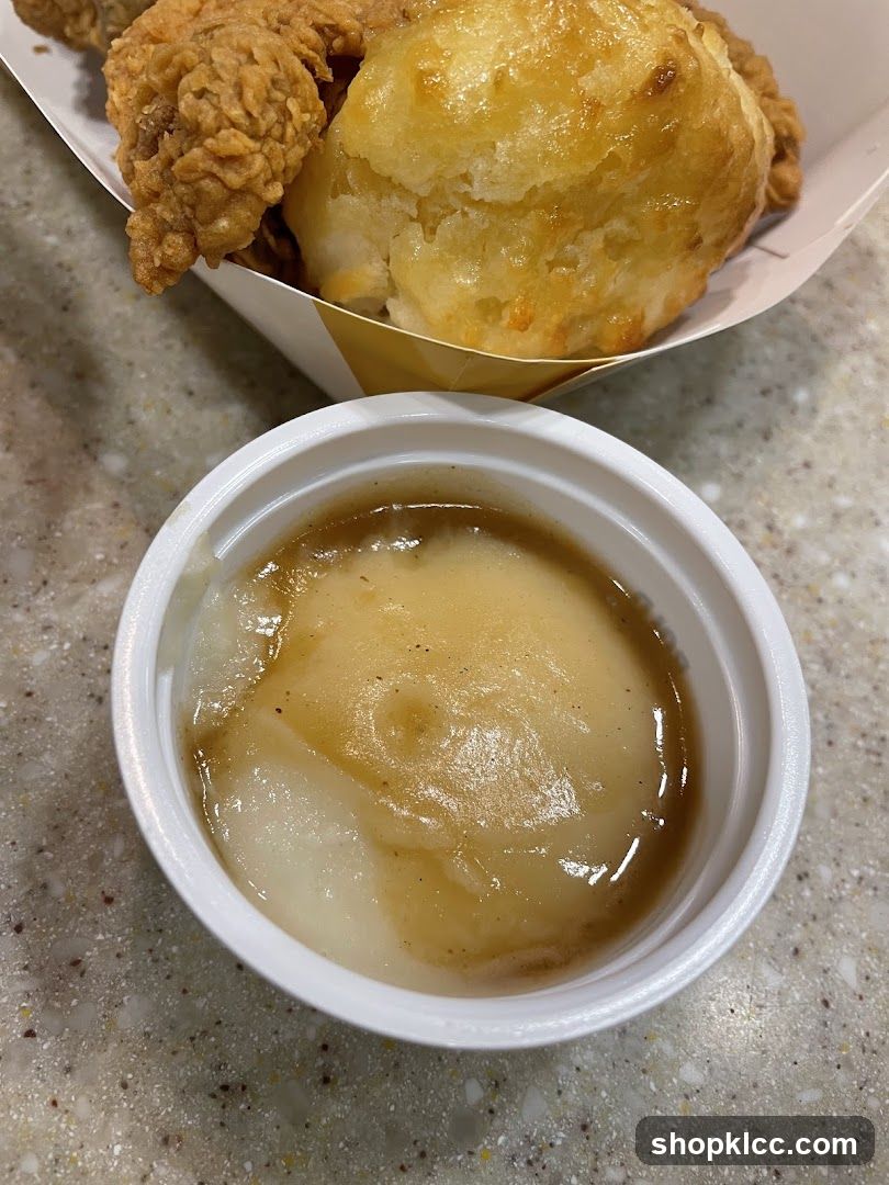Mashed Potatoes and Gravy with Fried Chicken and Biscuit