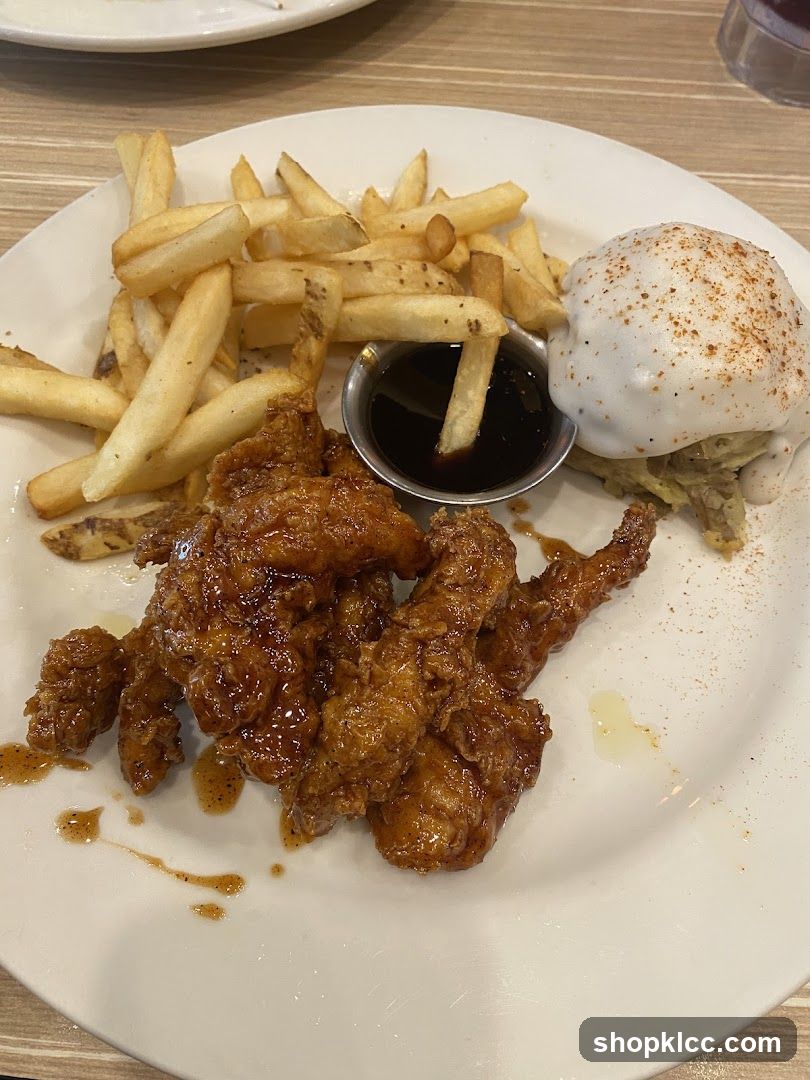 Chicken tenders with fries and sauce