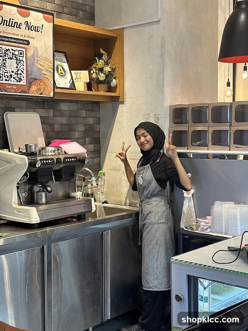Barista Posing by Espresso Machine
