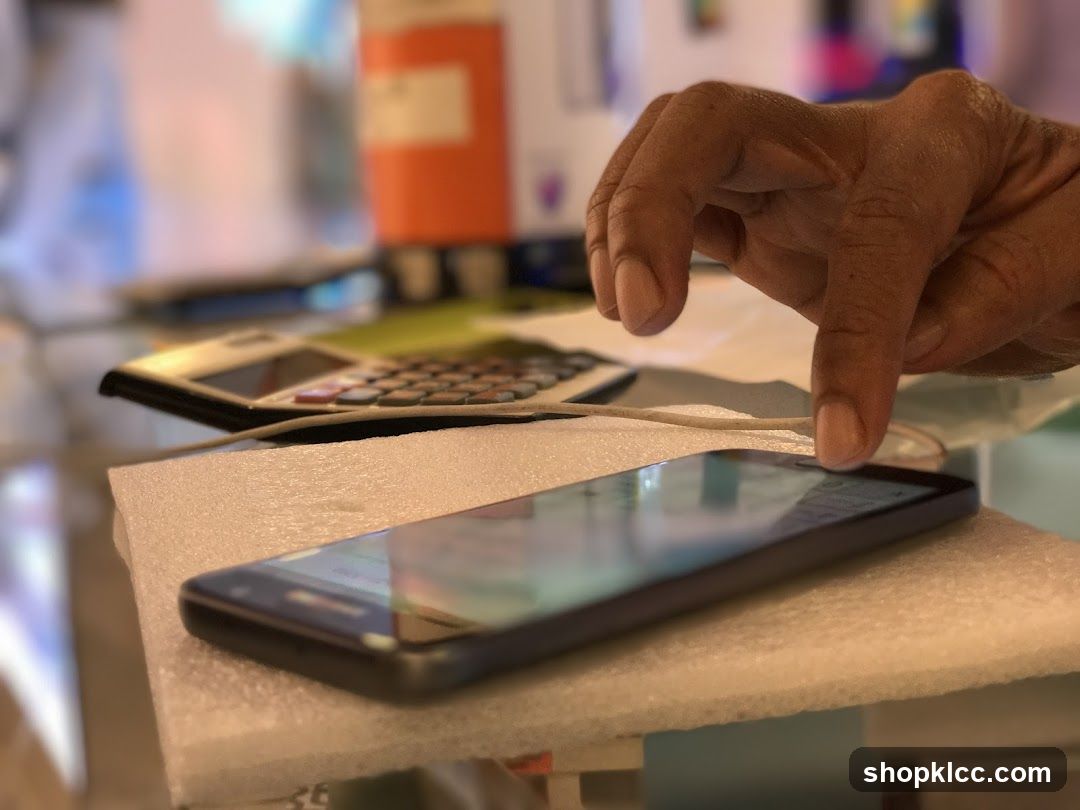 Hand interacting with smartphone on foam pad