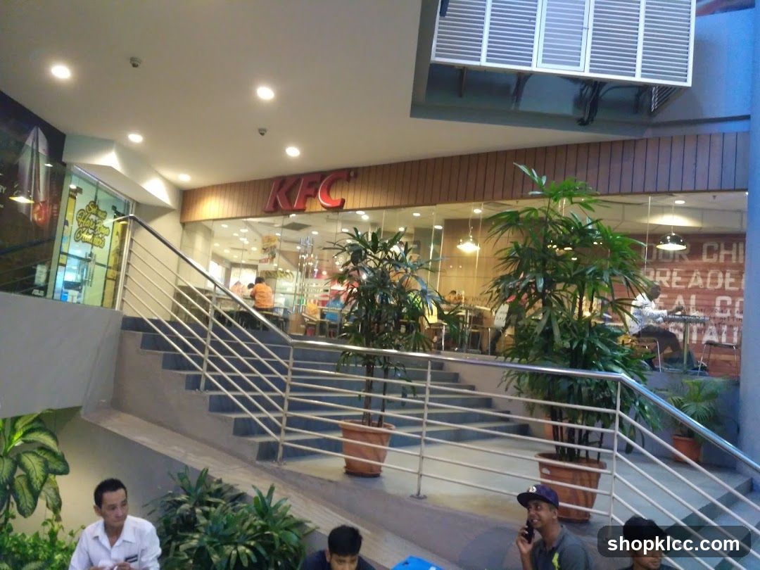 KFC Interior View with Stairs and Plants