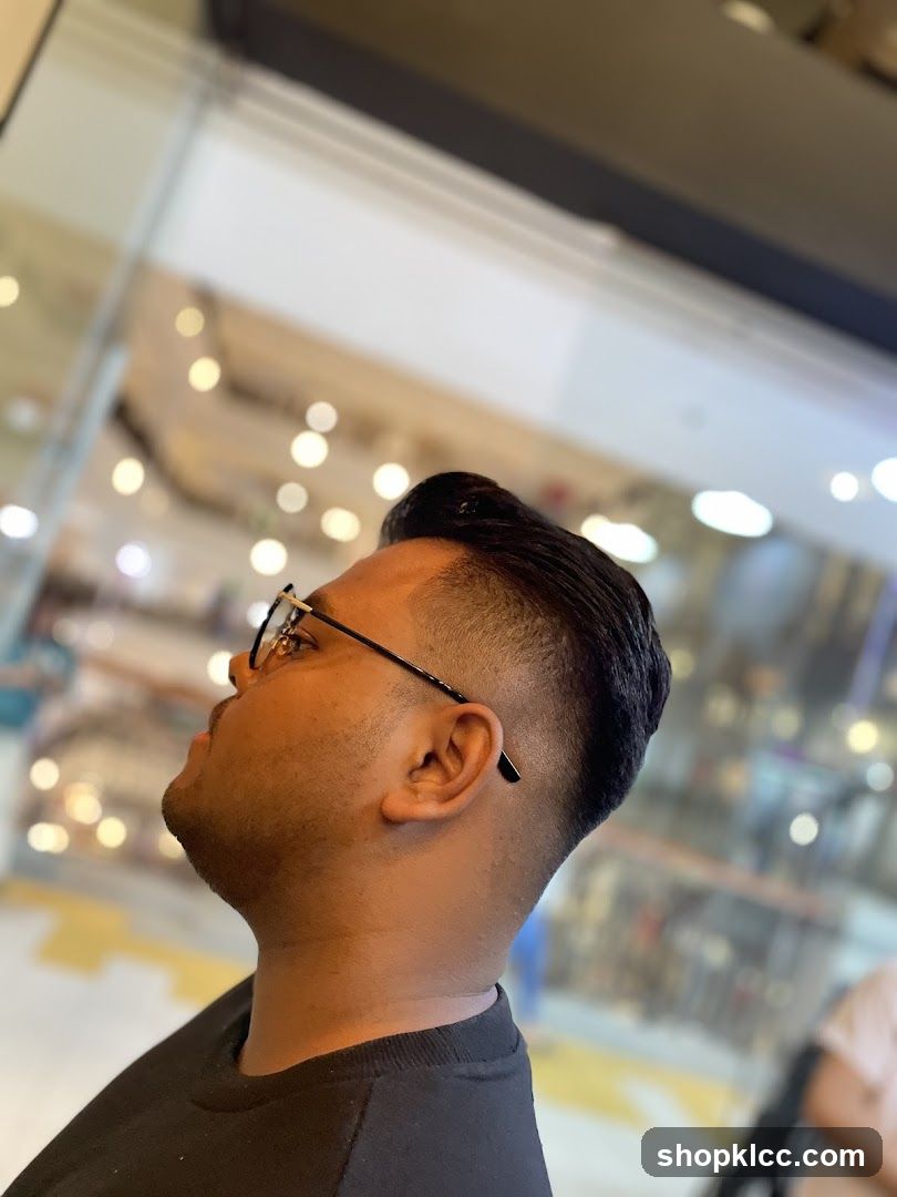 Man with modern haircut in mall interior