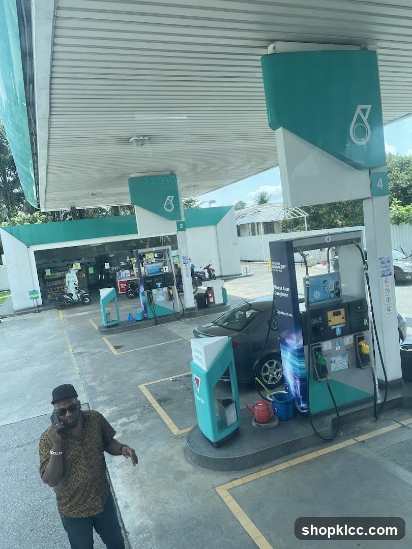 Gas Station Scene with Person on Phone