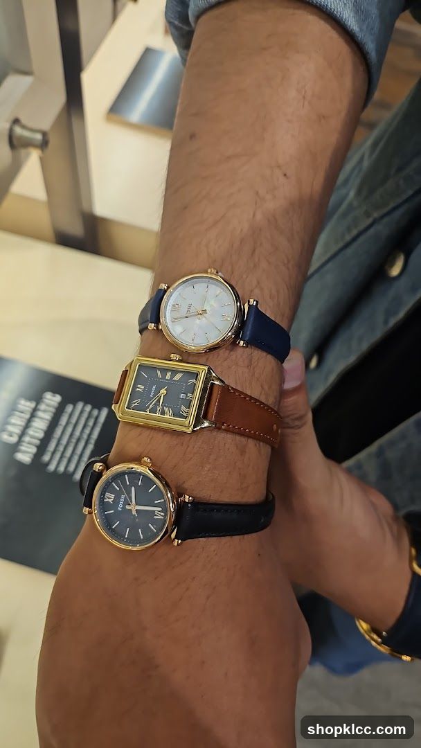 Three Fossil Watches on a Wrist