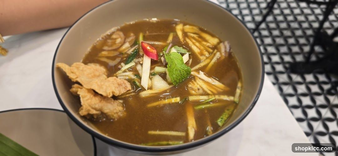 Bowl of Soup with Fried Crisps and Garnishes