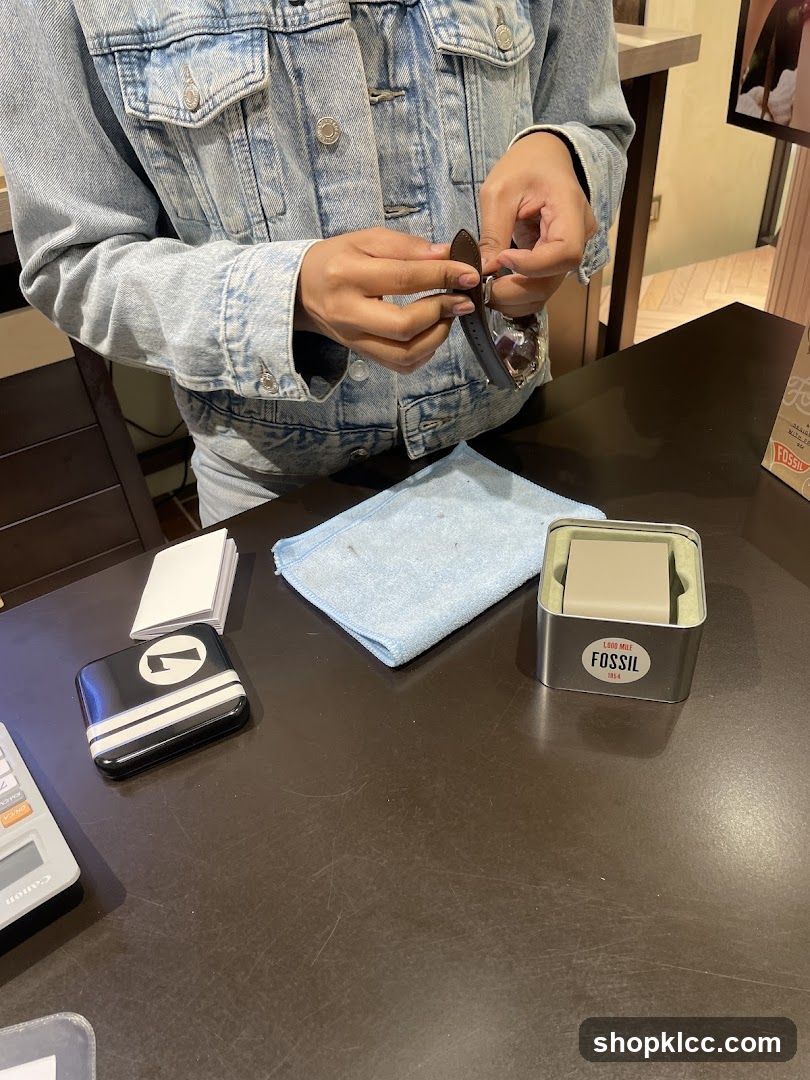 Person examining a watch