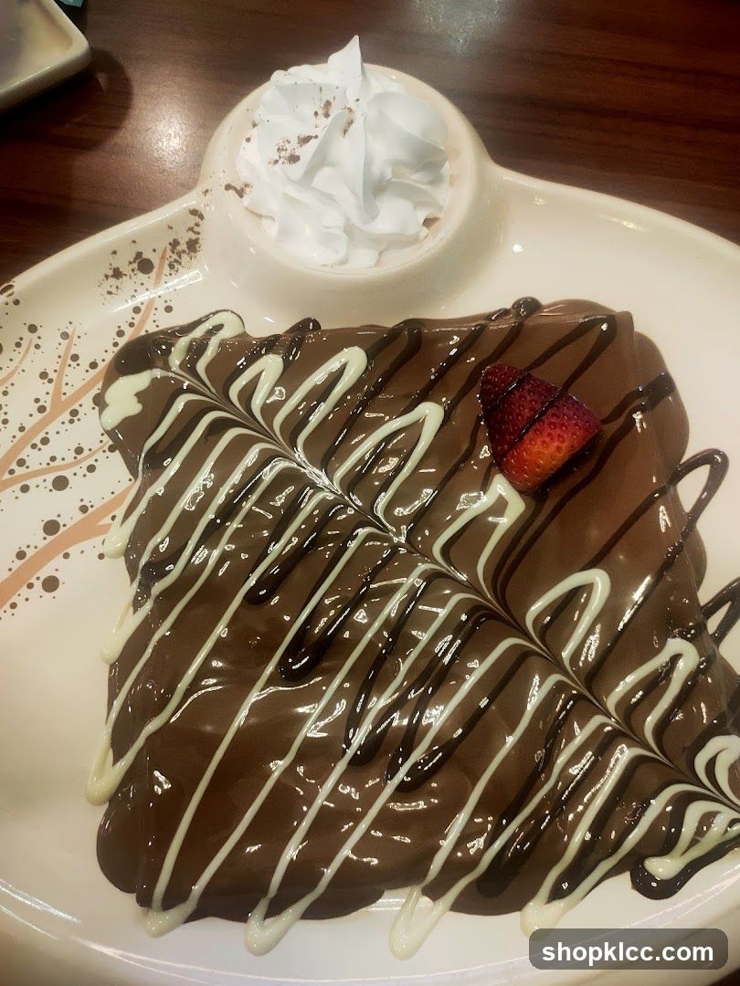 Chocolate Dessert with Whipped Cream and Strawberry