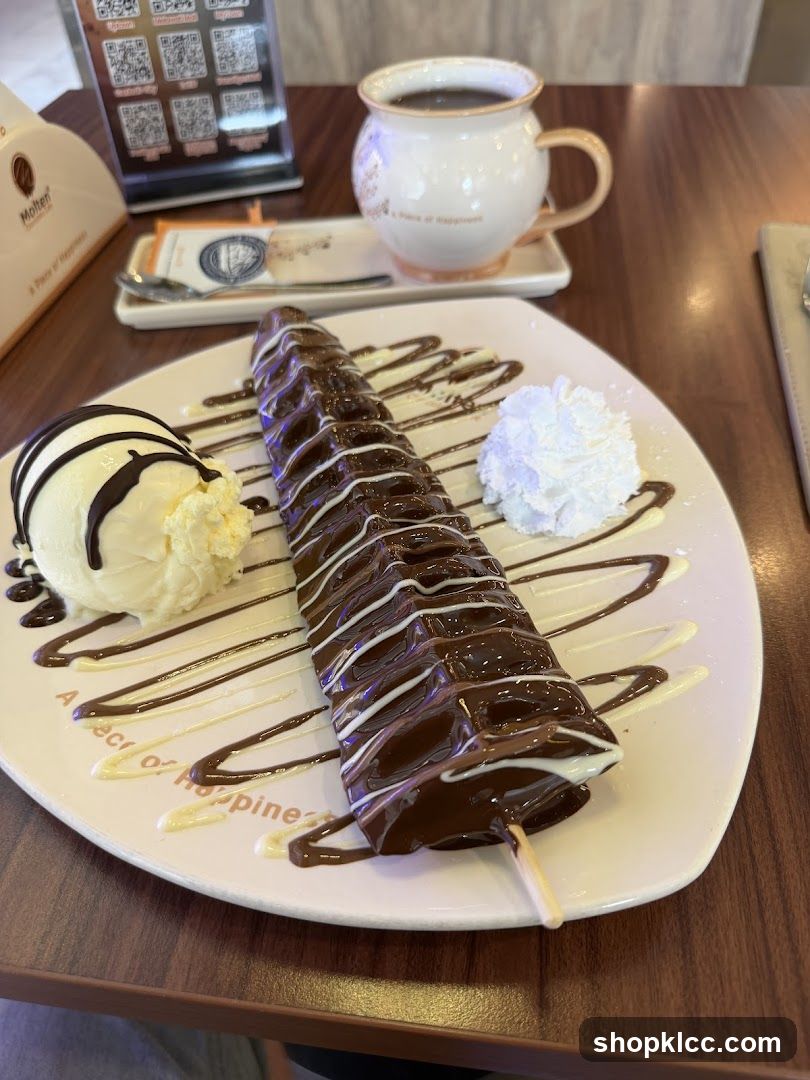 Chocolate-covered ice cream bar with whipped cream and coffee
