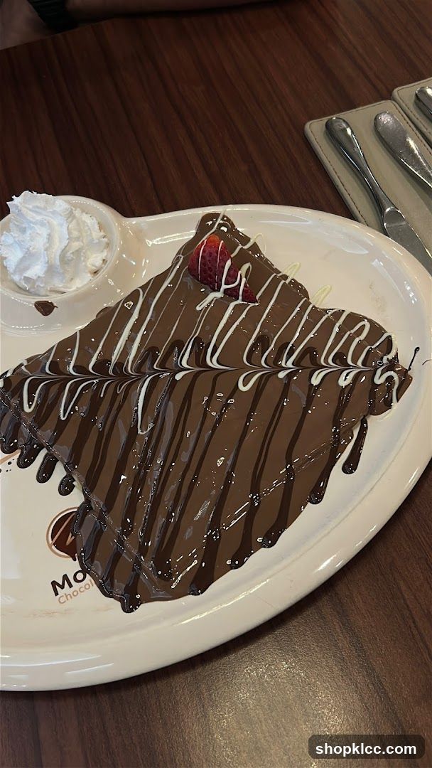 Chocolate Crepe with Whipped Cream and Strawberry
