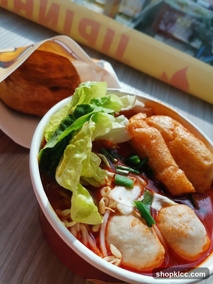 Spicy Noodle Bowl with Fish Balls and Lettuce