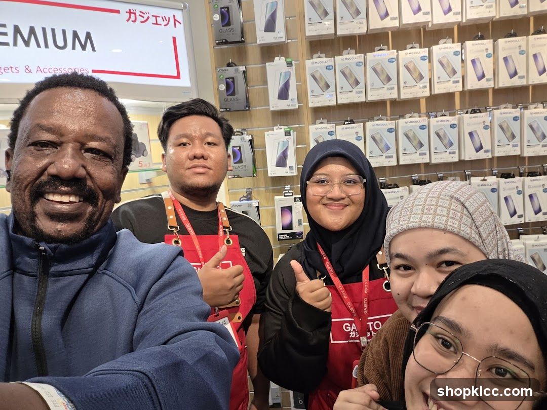 Group selfie in electronics store