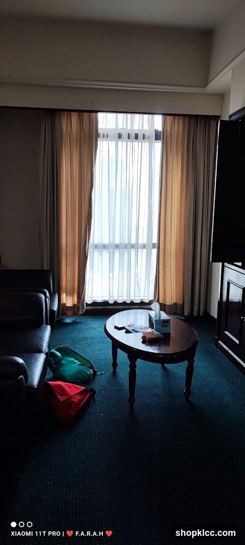 Hotel Room Interior with Coffee Table and Bags