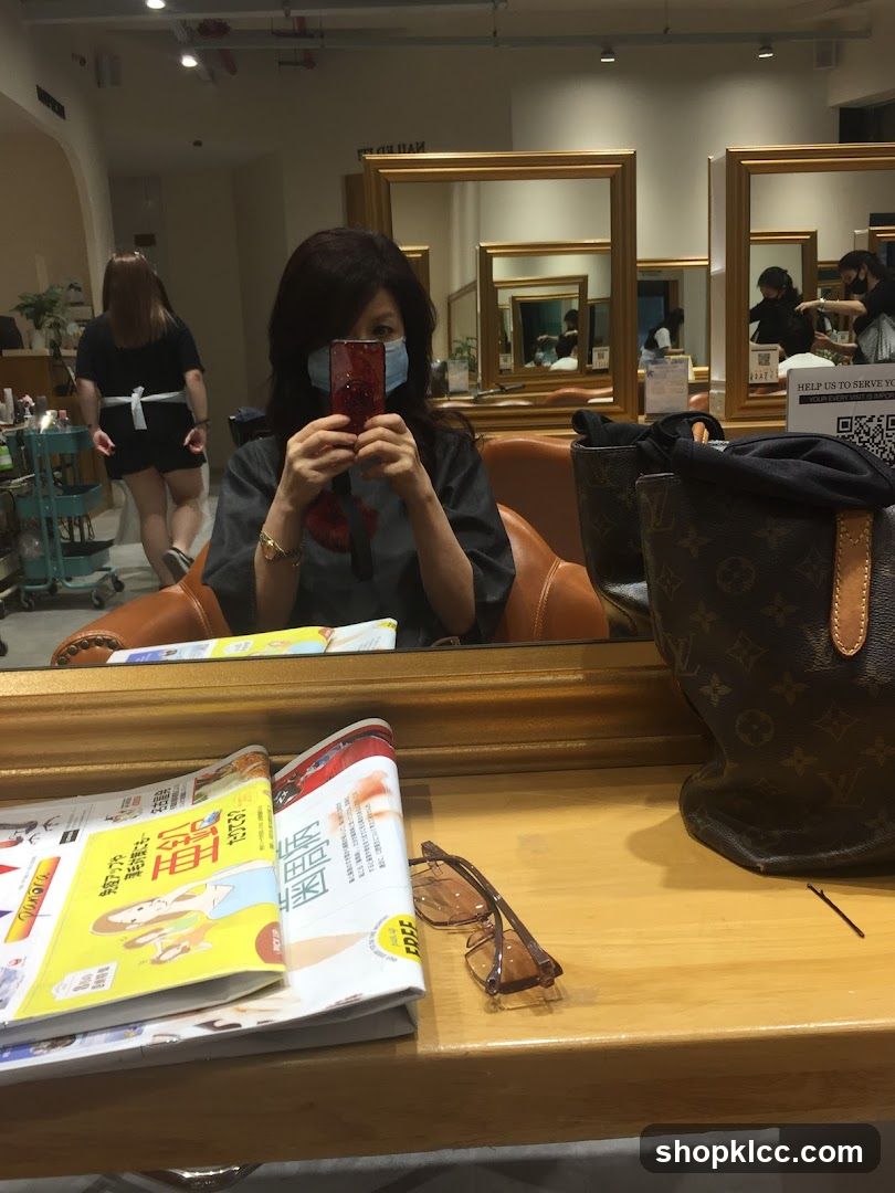 Woman taking a selfie in a salon