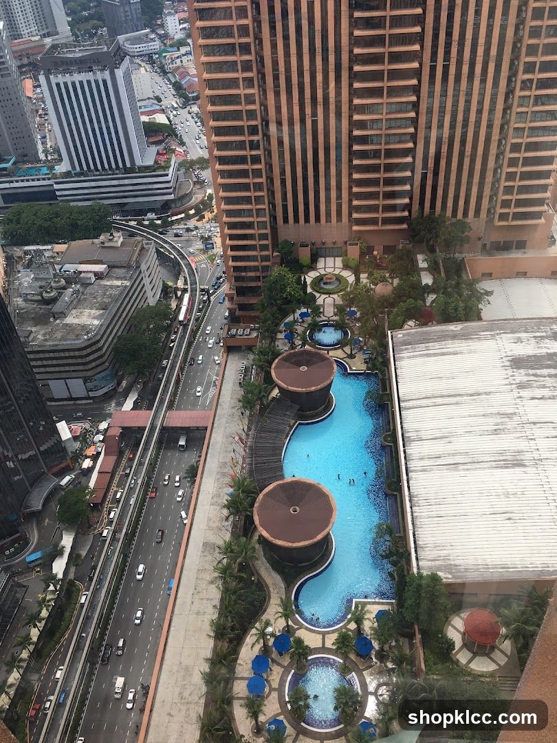 High-rise hotel pool area with city view