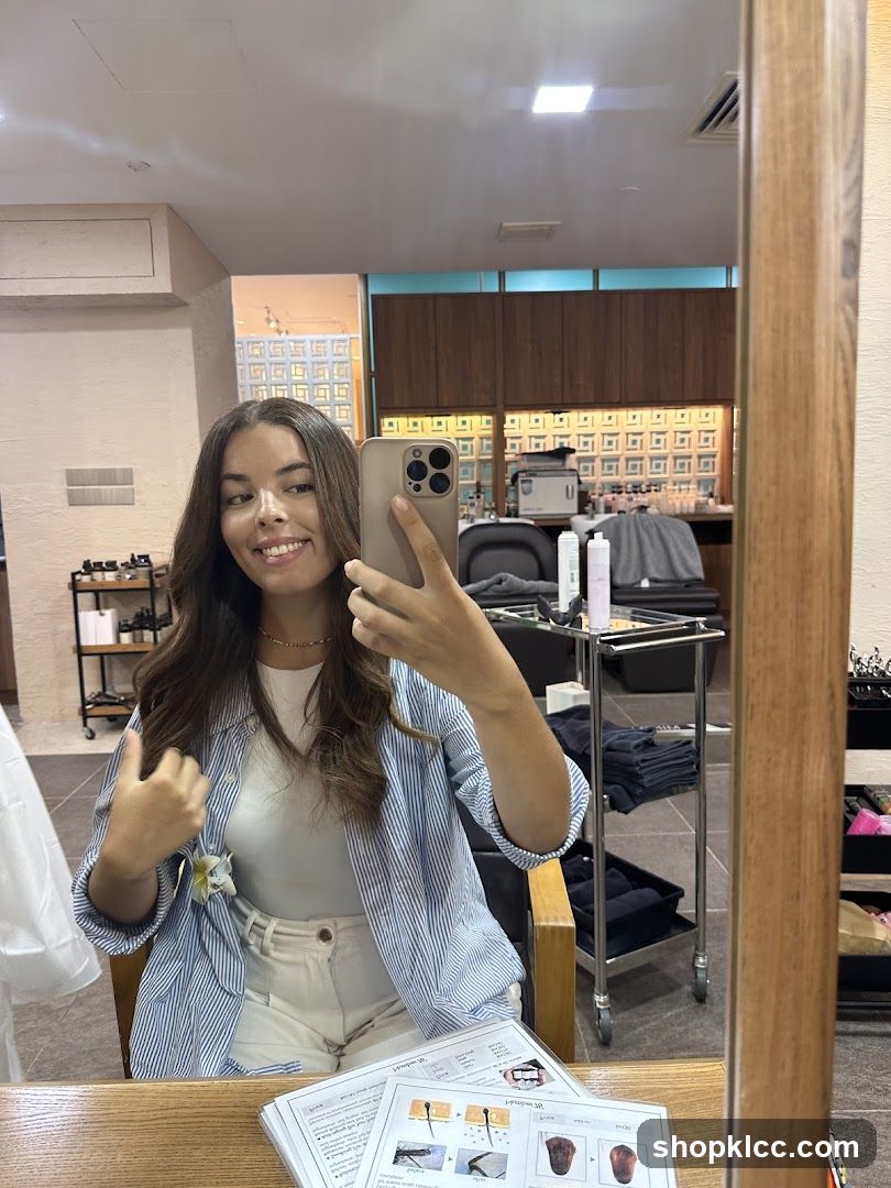 Woman taking a selfie in a salon