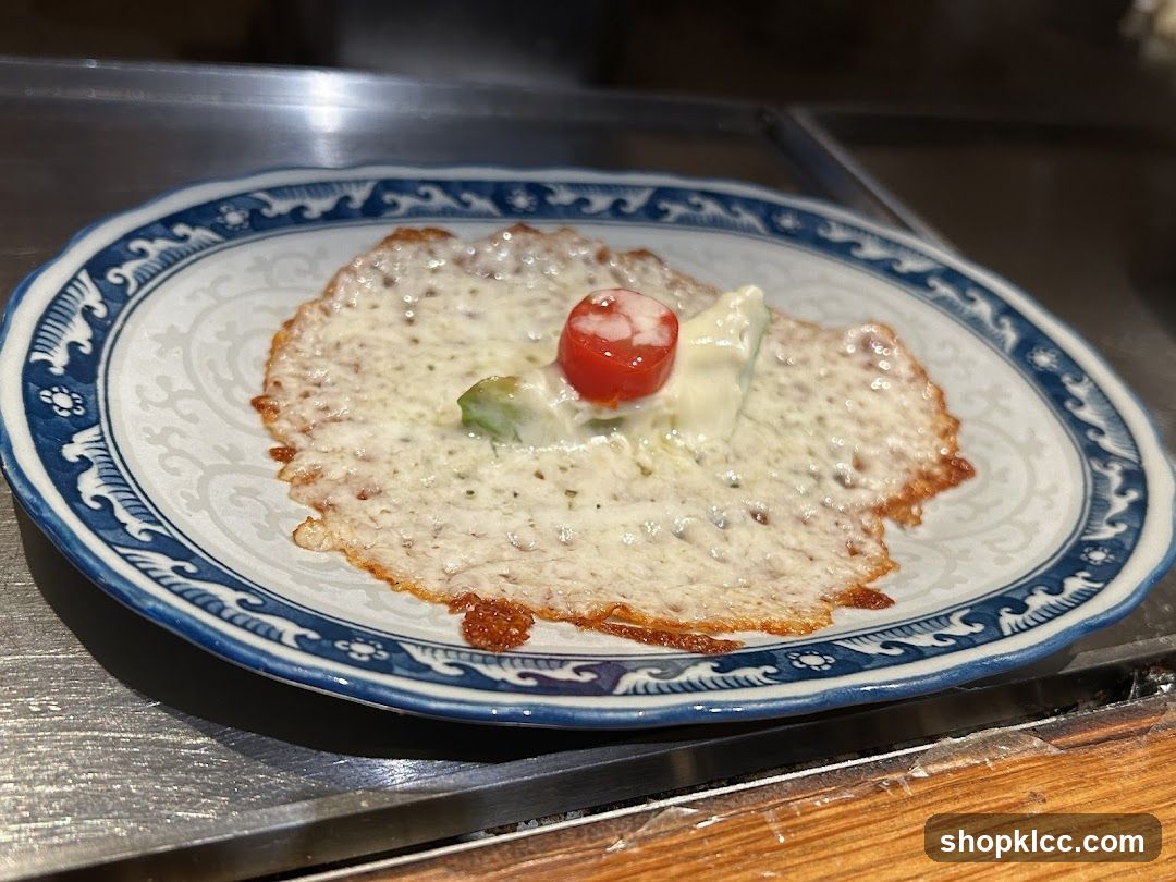 Cheese-covered dish with garnish