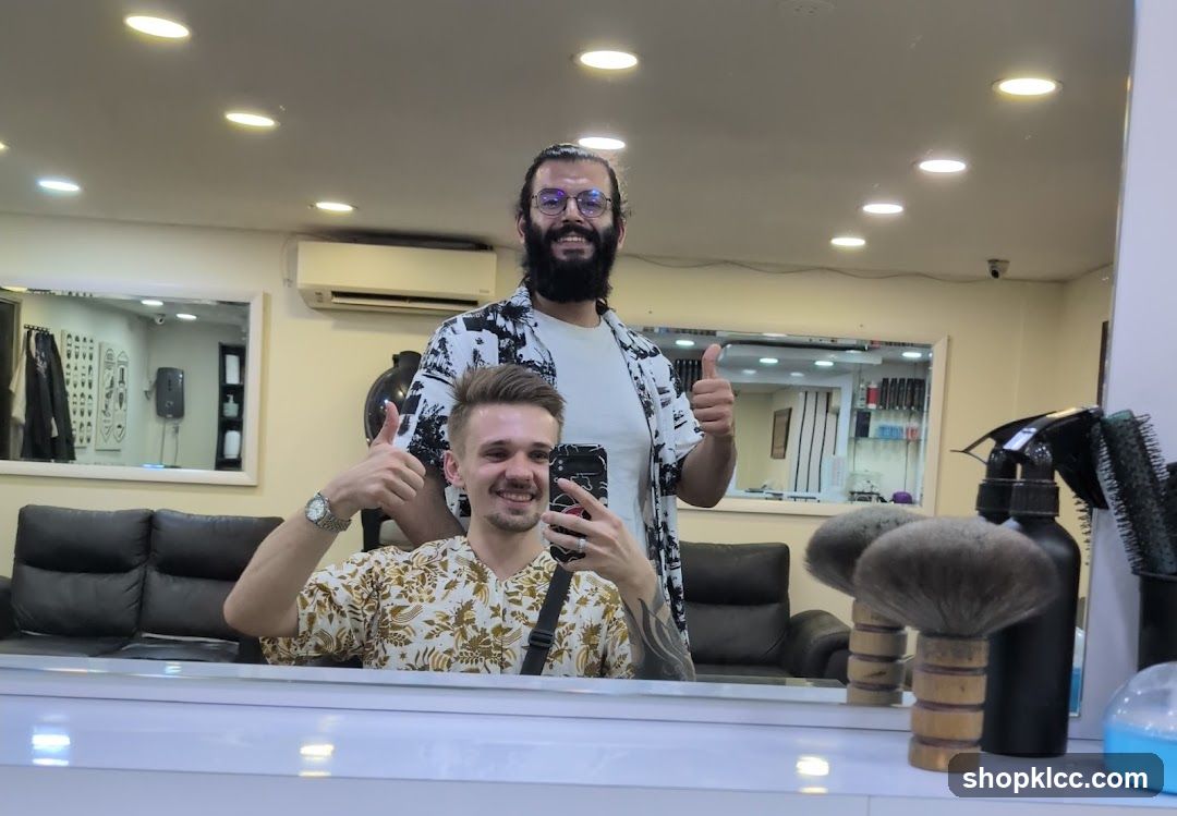 Barber Shop Interior with Two Men Giving Thumbs Up